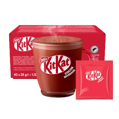 A steaming mug of KitKat cocoa beverage sits in front of a red box and a single serving packet of the drink mix.